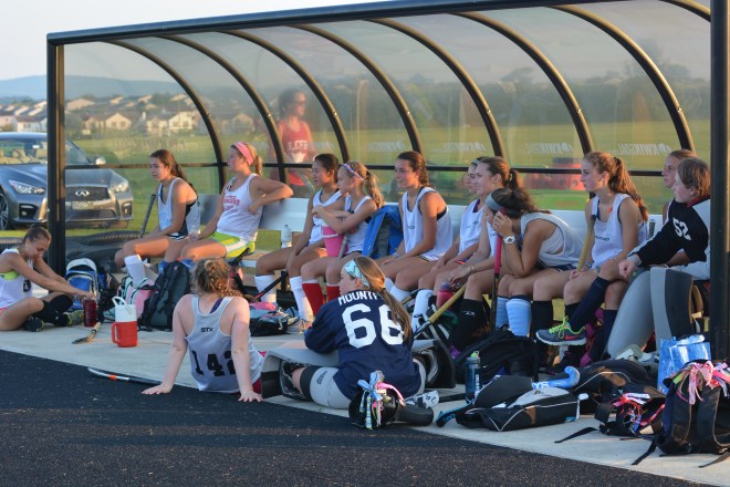 Campers absorb on field action between games