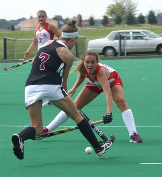 Ellen Colbourne dodges a Boston University defender in 2014