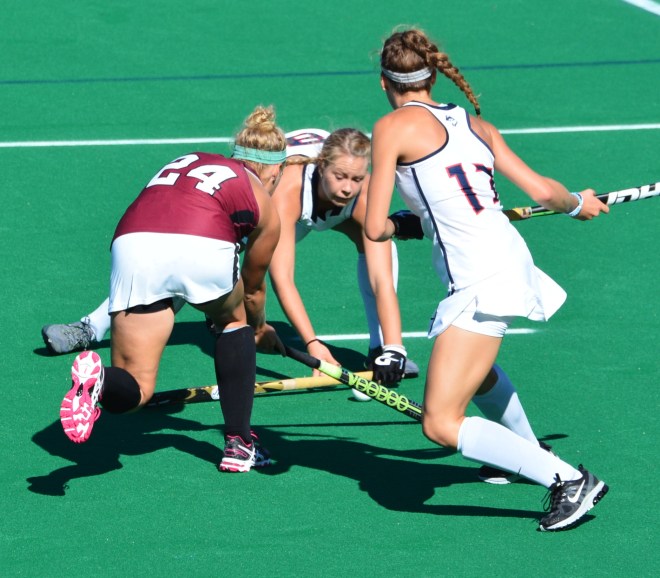 Aliza Furneaux powers her way through two Uconn defenders