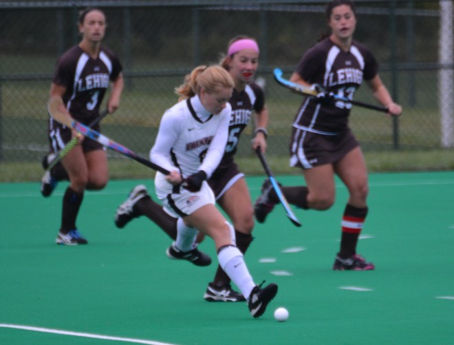 Ami Turner gets ahead of a Lehigh defender and passes the ball into the offensive circle
