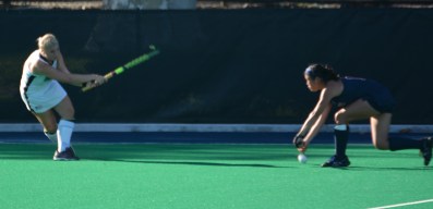 Freshman Rachel Bird hits the ball past a Penn defender