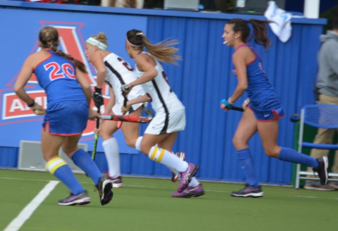 Aliza Furneaux looks downfield as she carries the ball into American's half of the field