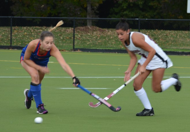 Kendall Weedling's stick gets the attention of an American defender