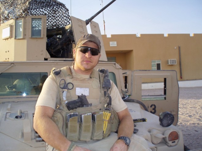 Kevin Lacz in front of humvee in Iraq