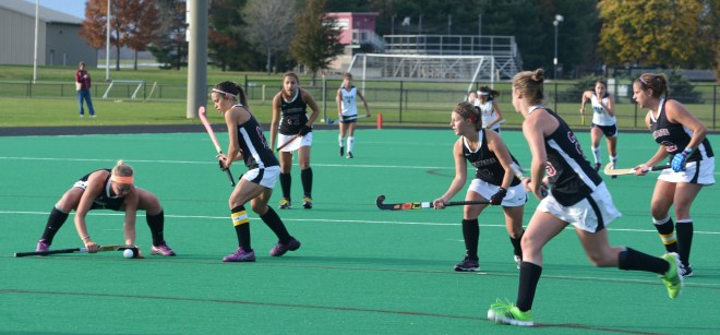 Corner offense of Kirby Szalkowski, Amanda Madagan, Abby Stefanides, Katie Birle, and Hannah Millen put the play in action